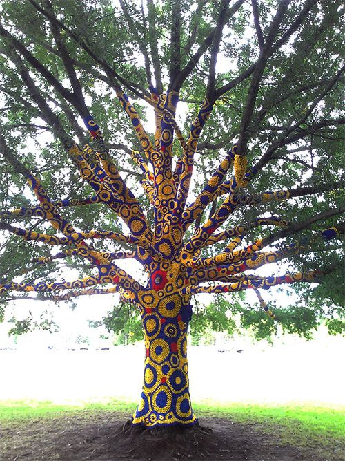 “Yarn bombing” of the tree outside the Creative Arts Center
